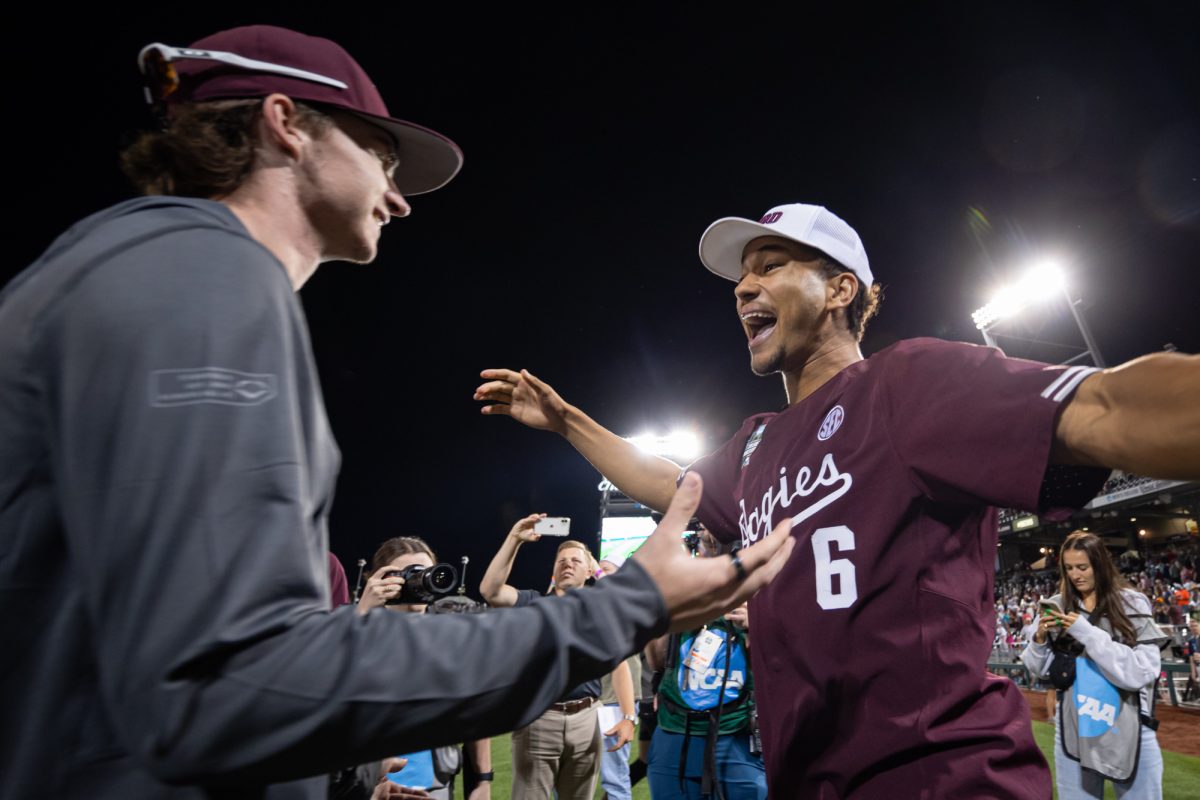 Texas A&M outfielder Braden Montgomery (6) hugs pitcher Shane Sdao (38) after Texas A&M’s win against Florida at the NCAA Men’s College World Series semifinals at Charles Schwab Field in Omaha, Nebraska on Wednesday, June 19, 2024. (Chris Swann/The Battalion)