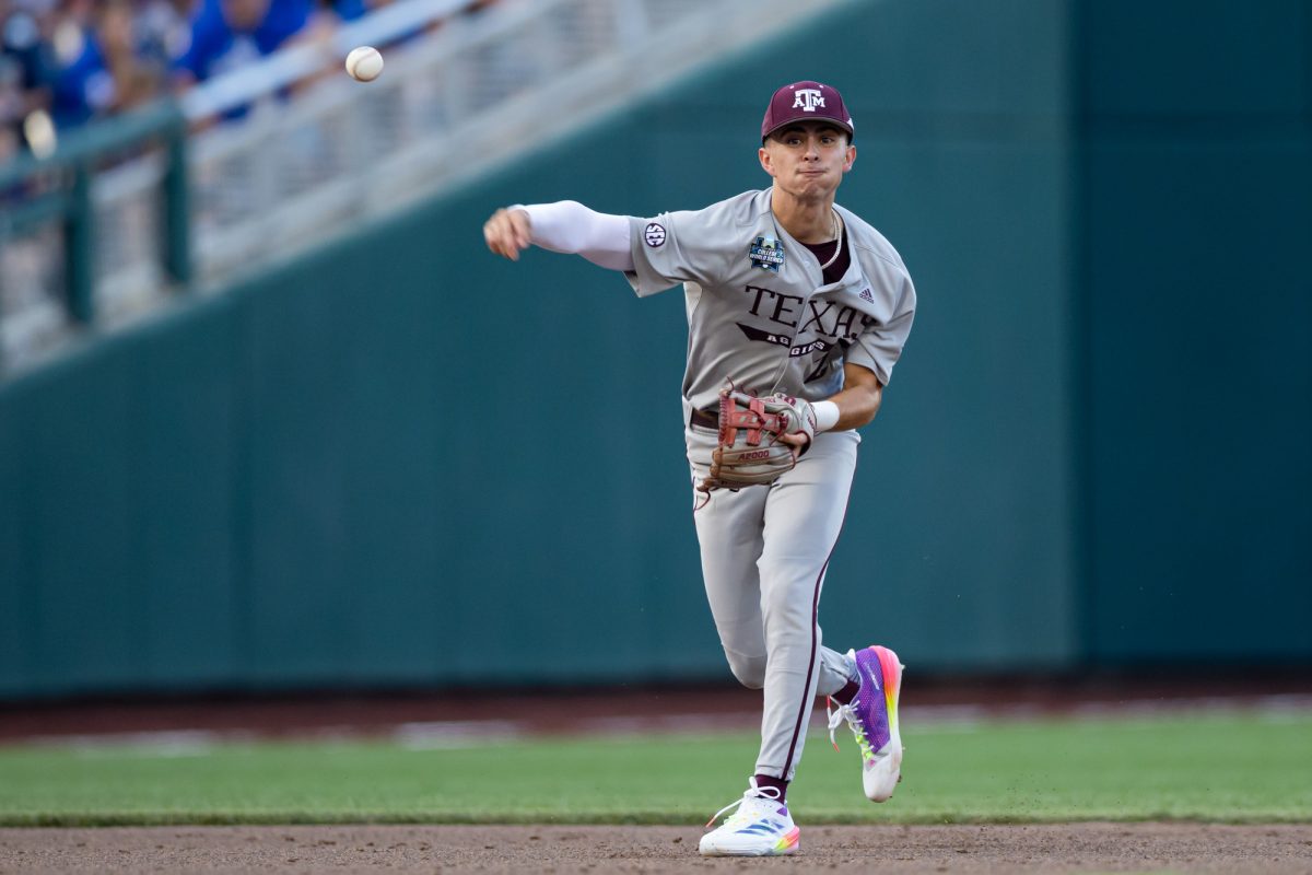 Texas A&M infielder Ali Camarillo (2) fields a ground ball during Texas A&M’s game against Kentucky at the NCAA Men’s College World Series at in Omaha, Nebraska on Monday, June 17, 2024. (Chris Swann/The Battalion)