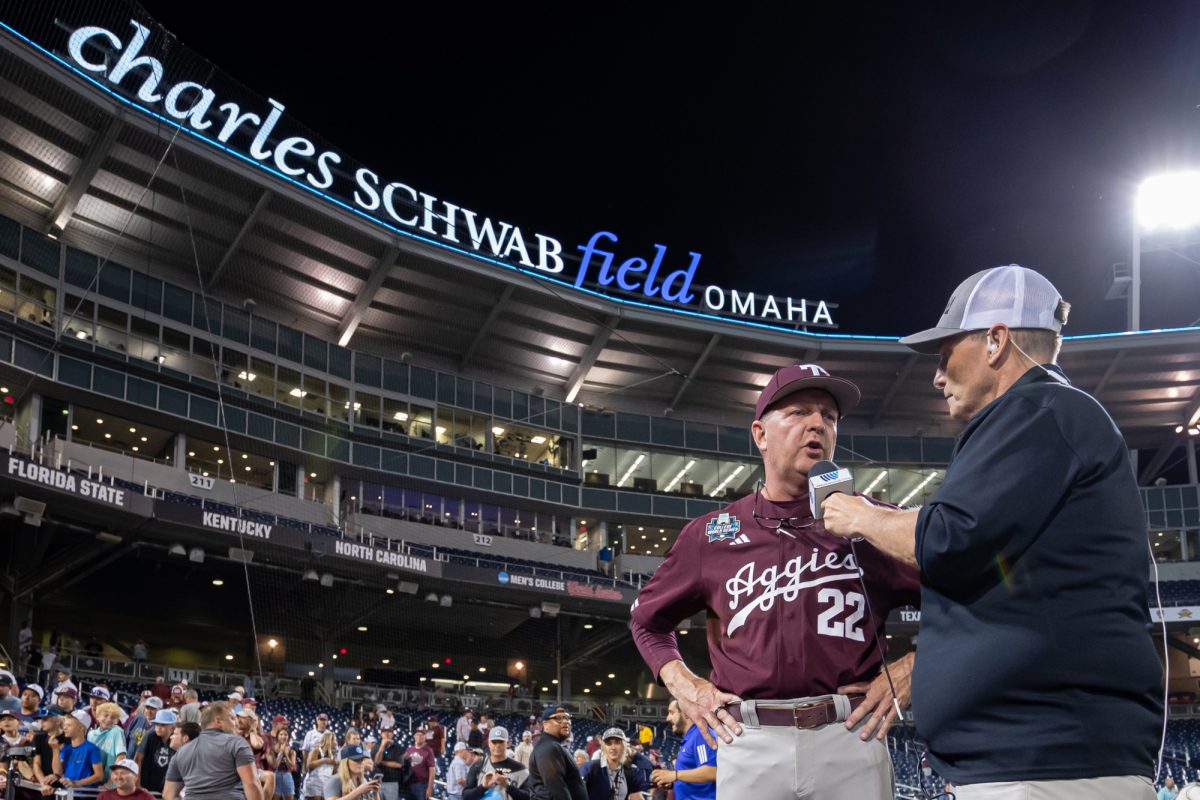 Texas A&M head coach Jim Schlossnagle (22) is interviewed after Texas A&M’s win against Florida at the NCAA Men’s College World Series semifinals at Charles Schwab Field in Omaha, Nebraska on Wednesday, June 19, 2024. (Chris Swann/The Battalion)