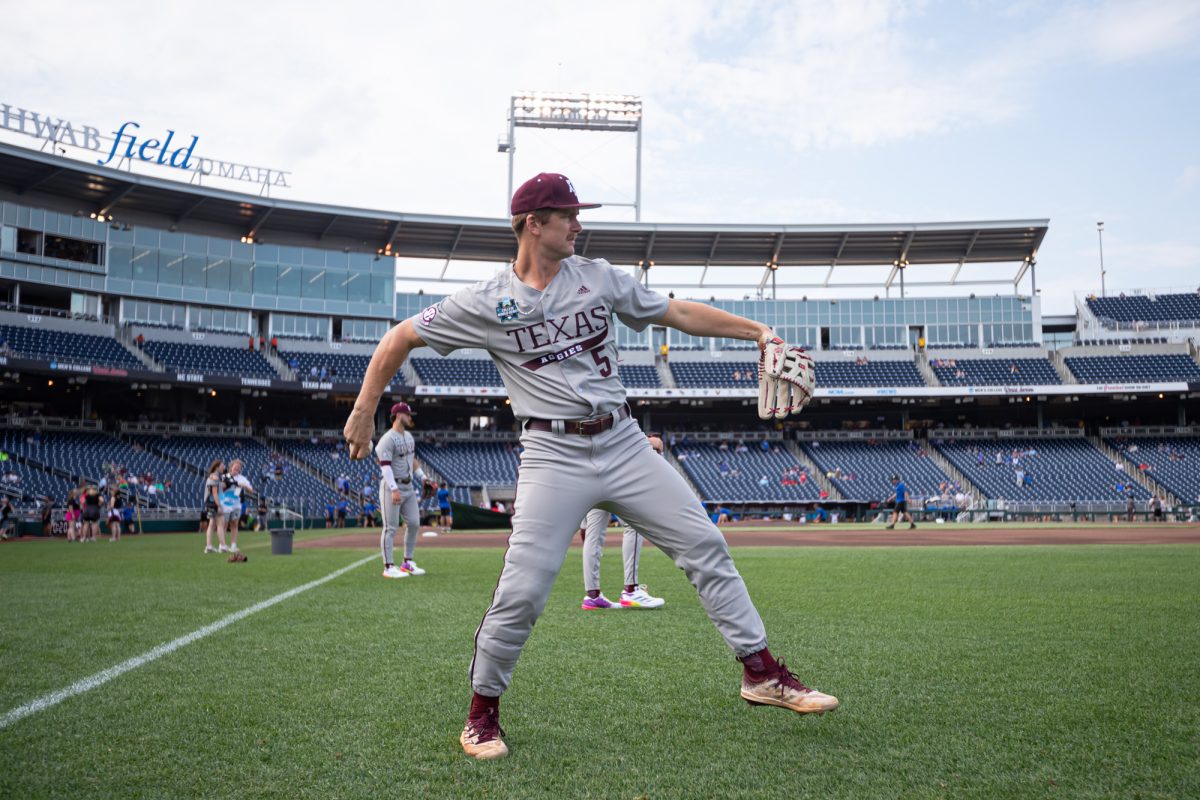 Texas A&M outfielder Hayden Schott (5) warms up before Texas A&M’s game against Kentucky at the NCAA Men’s College World Series at in Omaha, Nebraska on Monday, June 17, 2024. (Chris Swann/The Battalion)