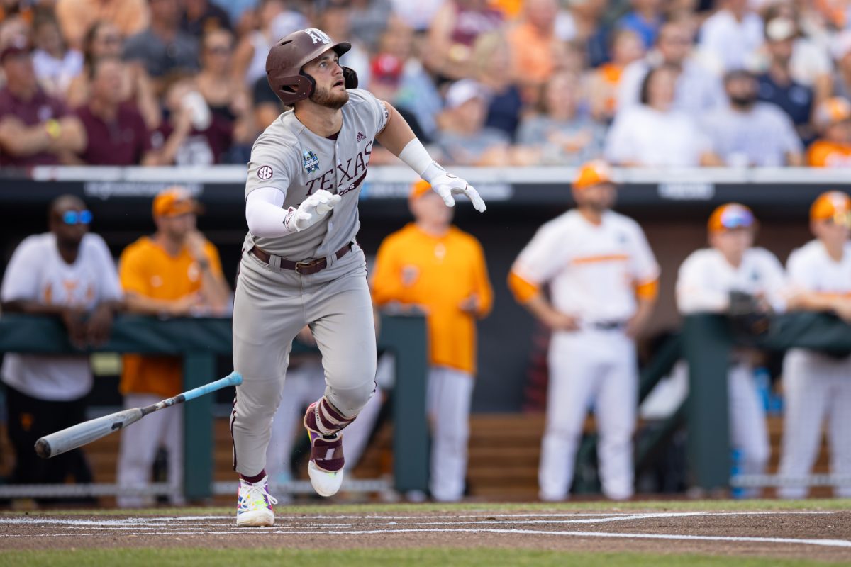 Texas A&M utility Gavin Grahovac (9) drops his bat after hitting a home-run during Texas A&M’s game against Tennessee at the NCAA Men’s College World Series finals at Charles Schwab Field in Omaha, Nebraska on Saturday, June 22, 2024. (Chris Swann/The Battalion)