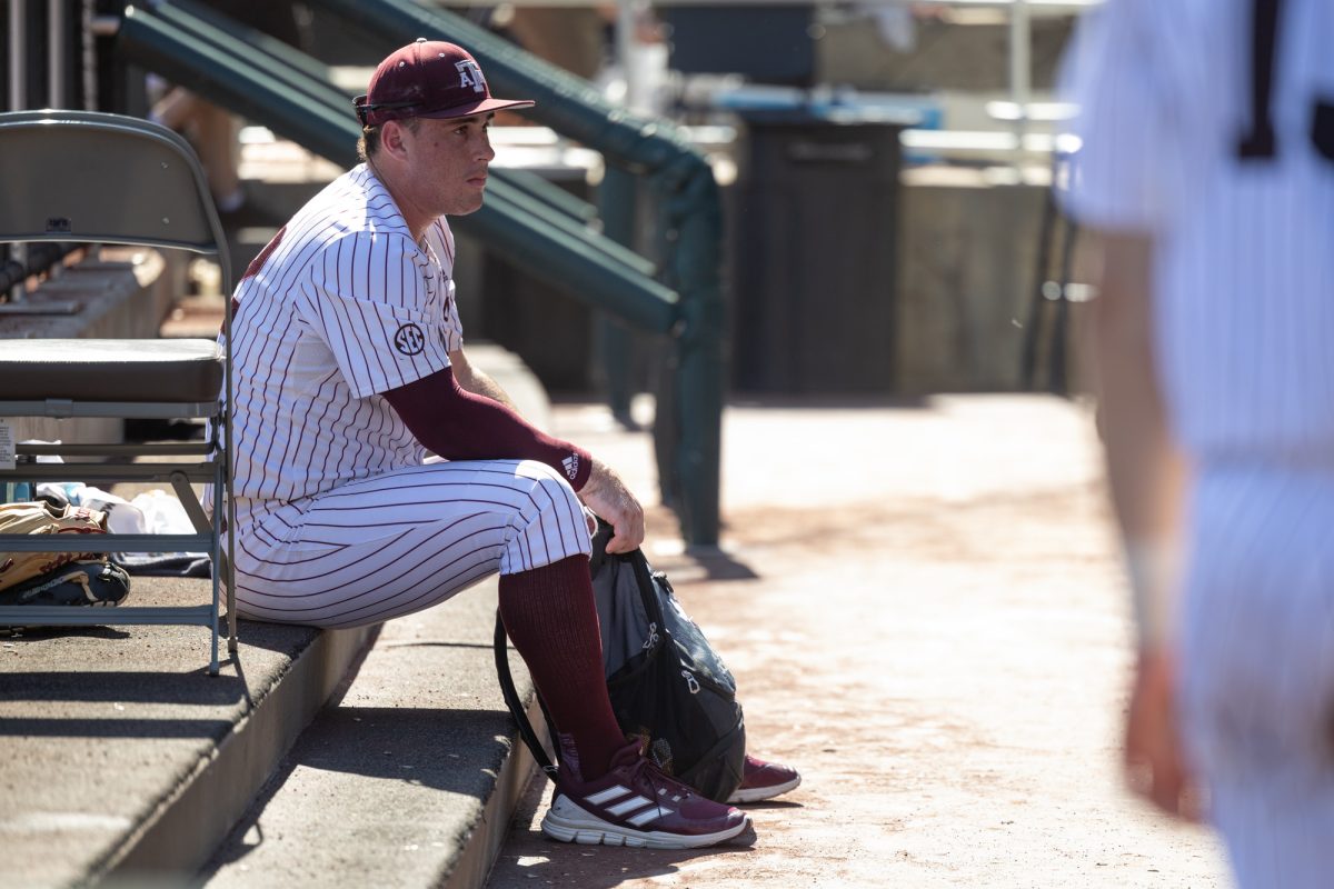 Texas A&M infielder Ryan Targac (12) packs up in the dugout after Texas A&M’s loss against Tennessee at the NCAA Men’s College World Series finals at Charles Schwab Field in Omaha, Nebraska on Saturday, June 22, 2024. (Chris Swann/The Battalion)