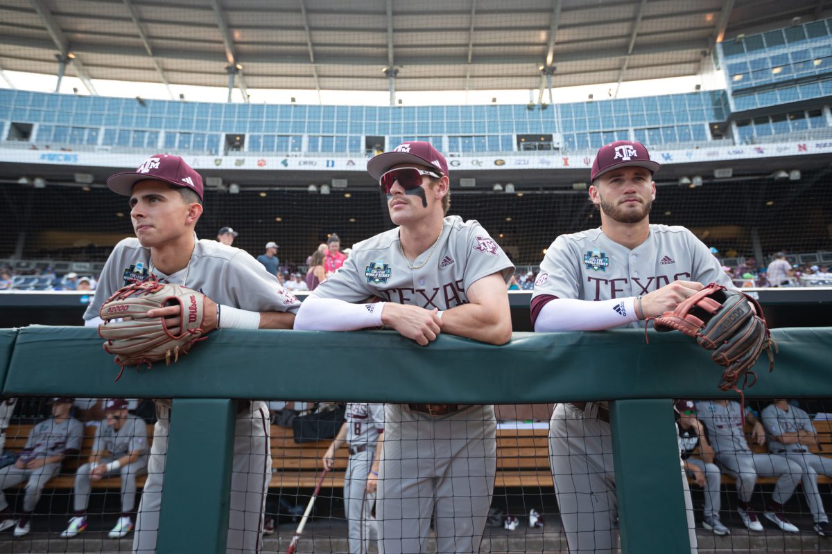 The Aggies stand in the dugout before Texas A&M’s game against Kentucky at the NCAA Men’s College World Series at in Omaha, Nebraska on Monday, June 17, 2024. (Chris Swann/The Battalion)