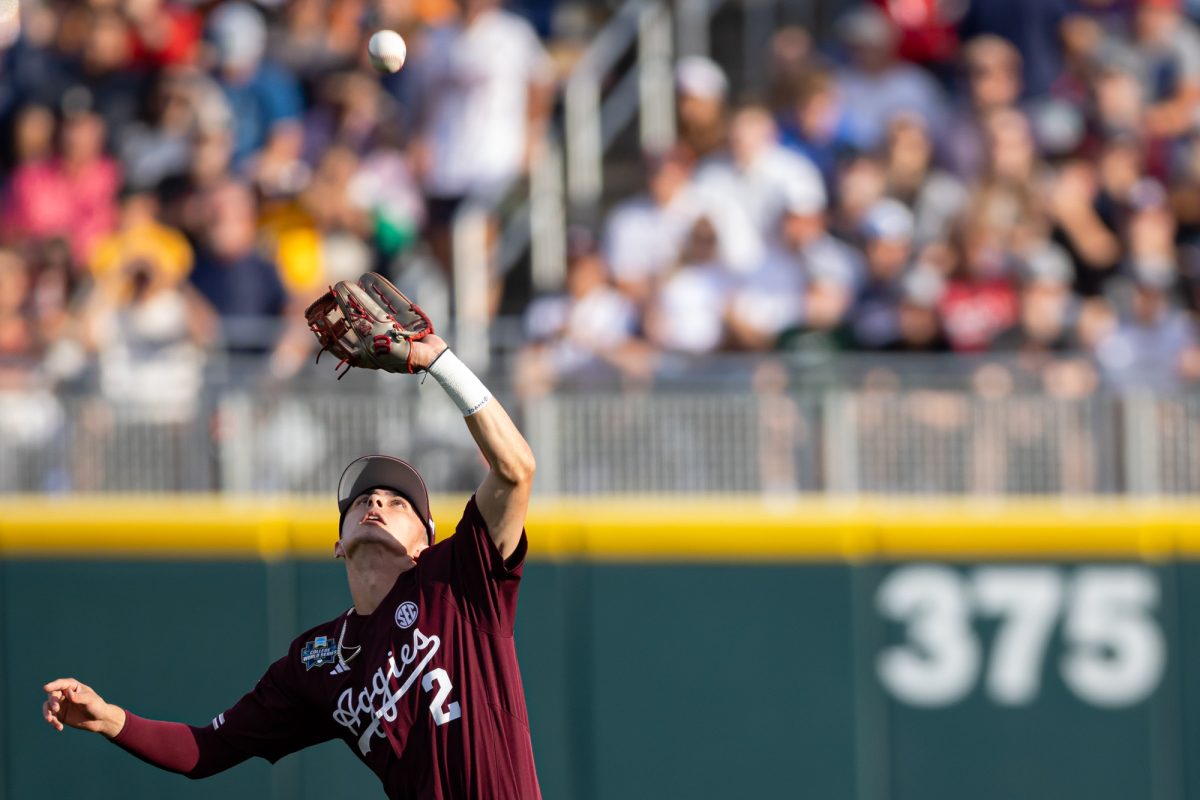 Texas A&M infielder Ali Camarillo (2) catches a pop fly during Texas A&M’s game against Florida at the NCAA Men’s College World Series semifinals at Charles Schwab Field in Omaha, Nebraska on Wednesday, June 19, 2024. (Chris Swann/The Battalion)