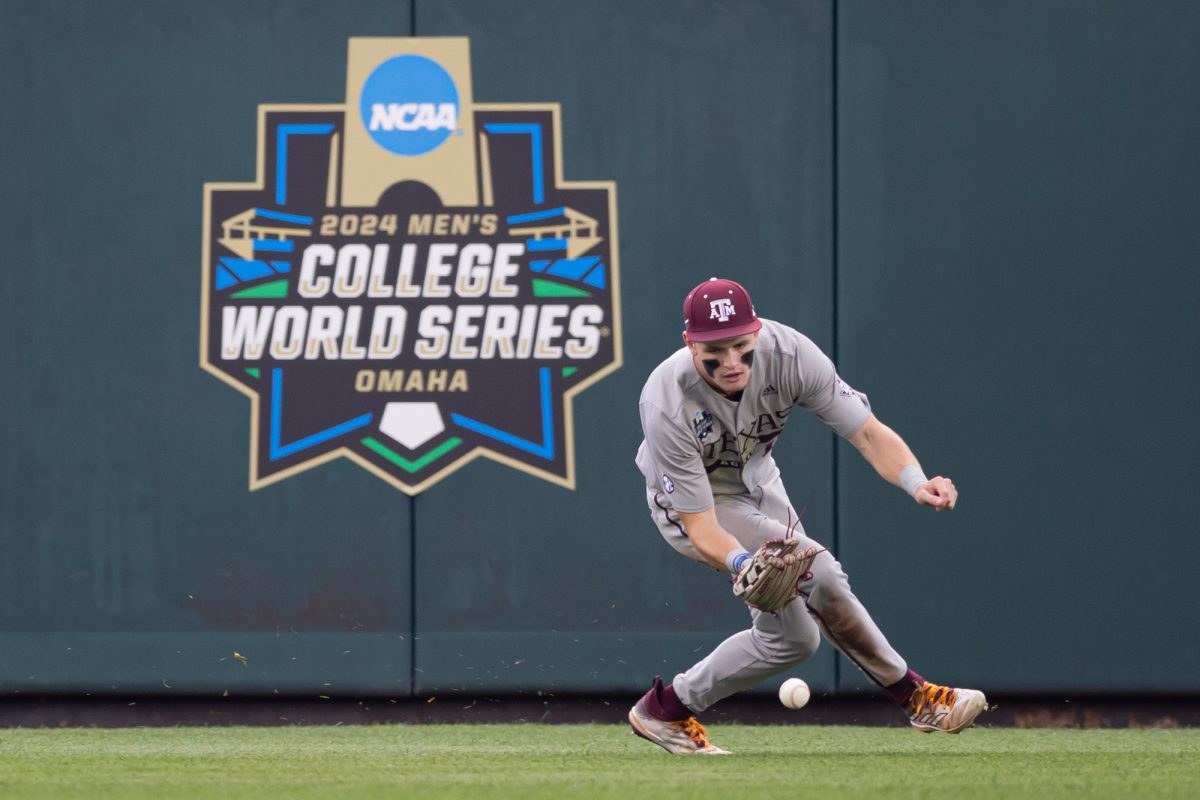 Texas A&M outfielder Caden Sorrell (13) fields a ground ball during Texas A&M’s game against Tennessee at the NCAA Men’s College World Series finals at Charles Schwab Field in Omaha, Nebraska on Saturday, June 22, 2024. (Chris Swann/The Battalion)