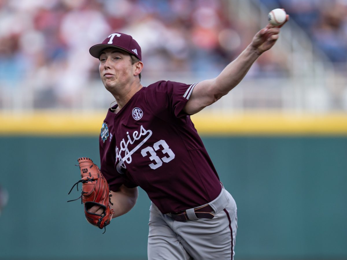 Texas A&M pitcher Justin Lamkin (33) delivers a pitch during Texas A&M’s game against Florida at the NCAA Men’s College World Series semifinals at Charles Schwab Field in Omaha, Nebraska on Wednesday, June 19, 2024. (Chris Swann/The Battalion)