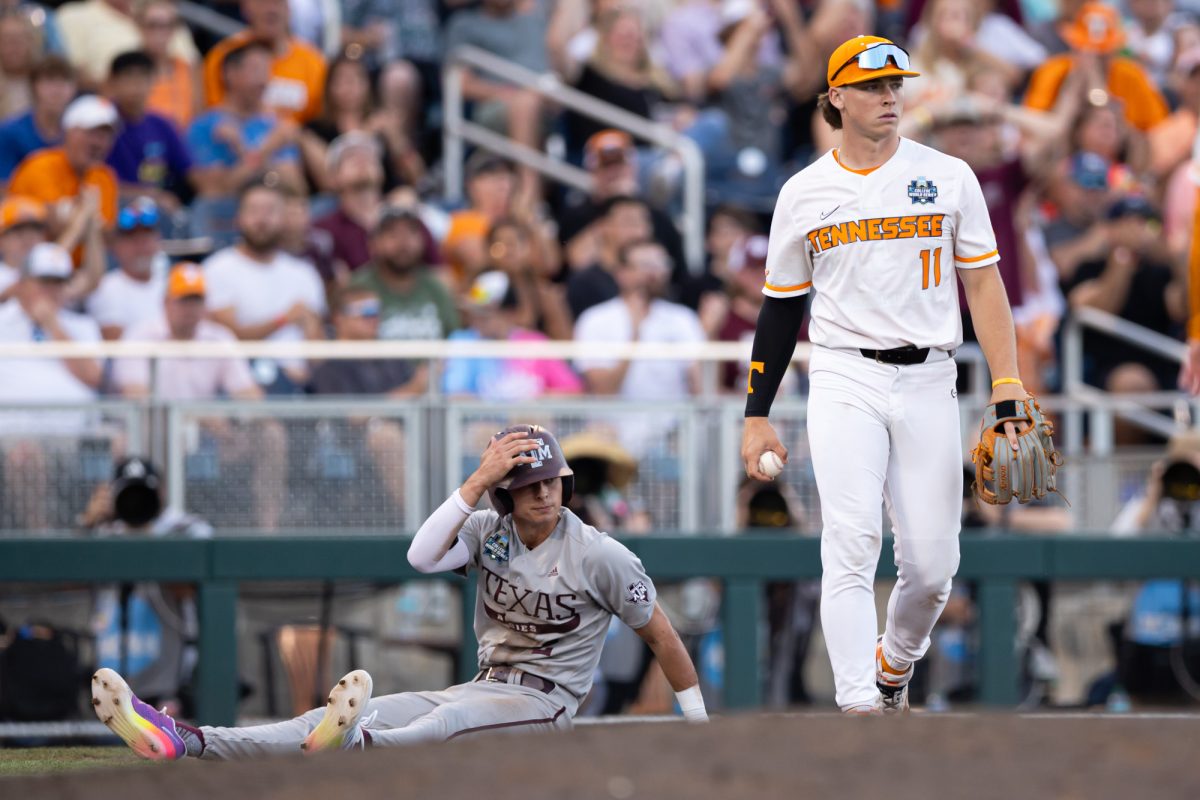 Texas A&M infielder Ali Camarillo (2) awaits a call by the ump after attempting to steal third base during Texas A&M’s game against Tennessee at the NCAA Men’s College World Series finals at Charles Schwab Field in Omaha, Nebraska on Saturday, June 22, 2024. (Chris Swann/The Battalion)