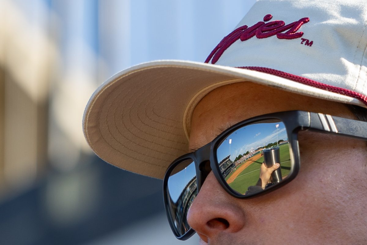 A fan looks at the field before Texas A&M’s game against Oregon at the NCAA Bryan-College Station Super Regional at Olsen Field on Sunday, June 9, 2024. (CJ Smith/The Battalion)