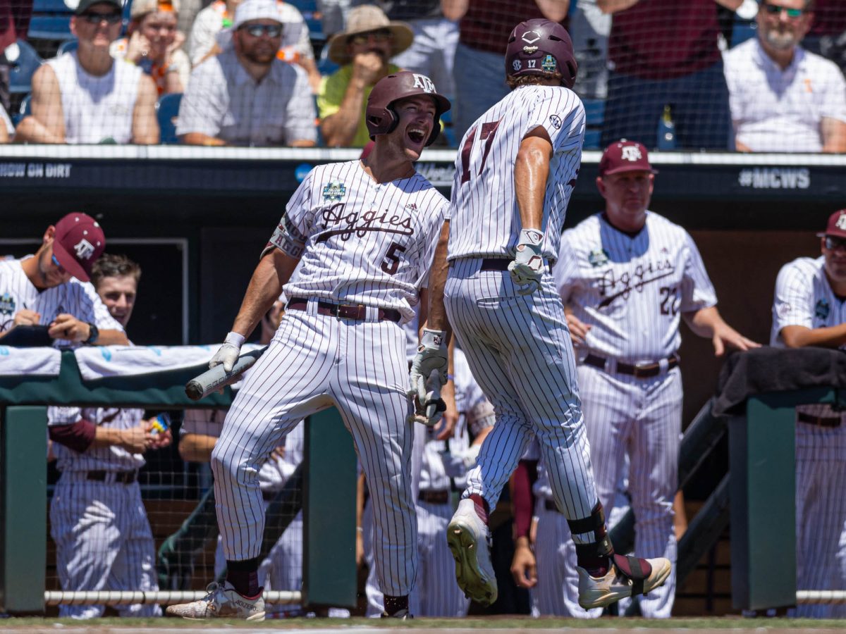Texas A&M outfielder Hayden Schott (5) celebrates a home-run with Texas A&M outfielder Jace LaViolette (17) during Texas A&M’s game against Tennessee at the NCAA Men’s College World Series finals at Charles Schwab Field in Omaha, Nebraska on Sunday, June 23, 2024. (Hannah Harrison/The Battalion)