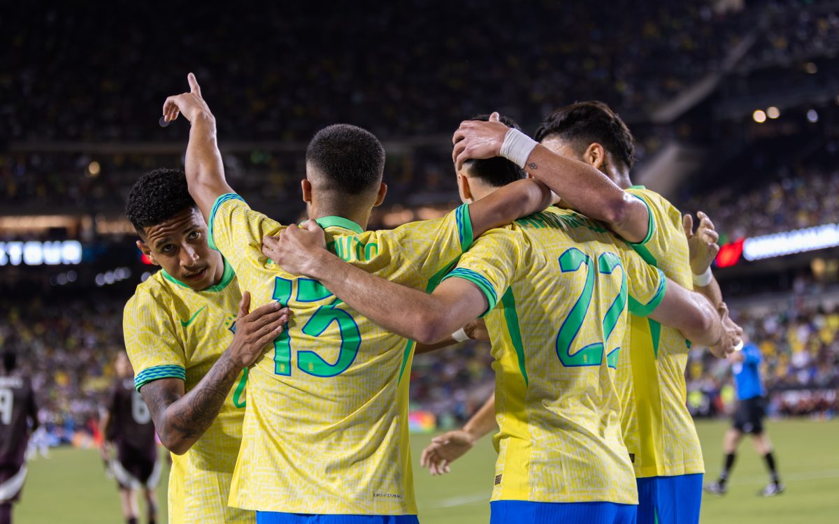 Brazil D Yan Couto (13) and F Gabriel Martinelli (22) celebrate with teammates after Martinellis goal against Mexico during the MexTour match at Kyle Field on Saturday, June 8, 2024. (Kyle Heise/The Battalion)