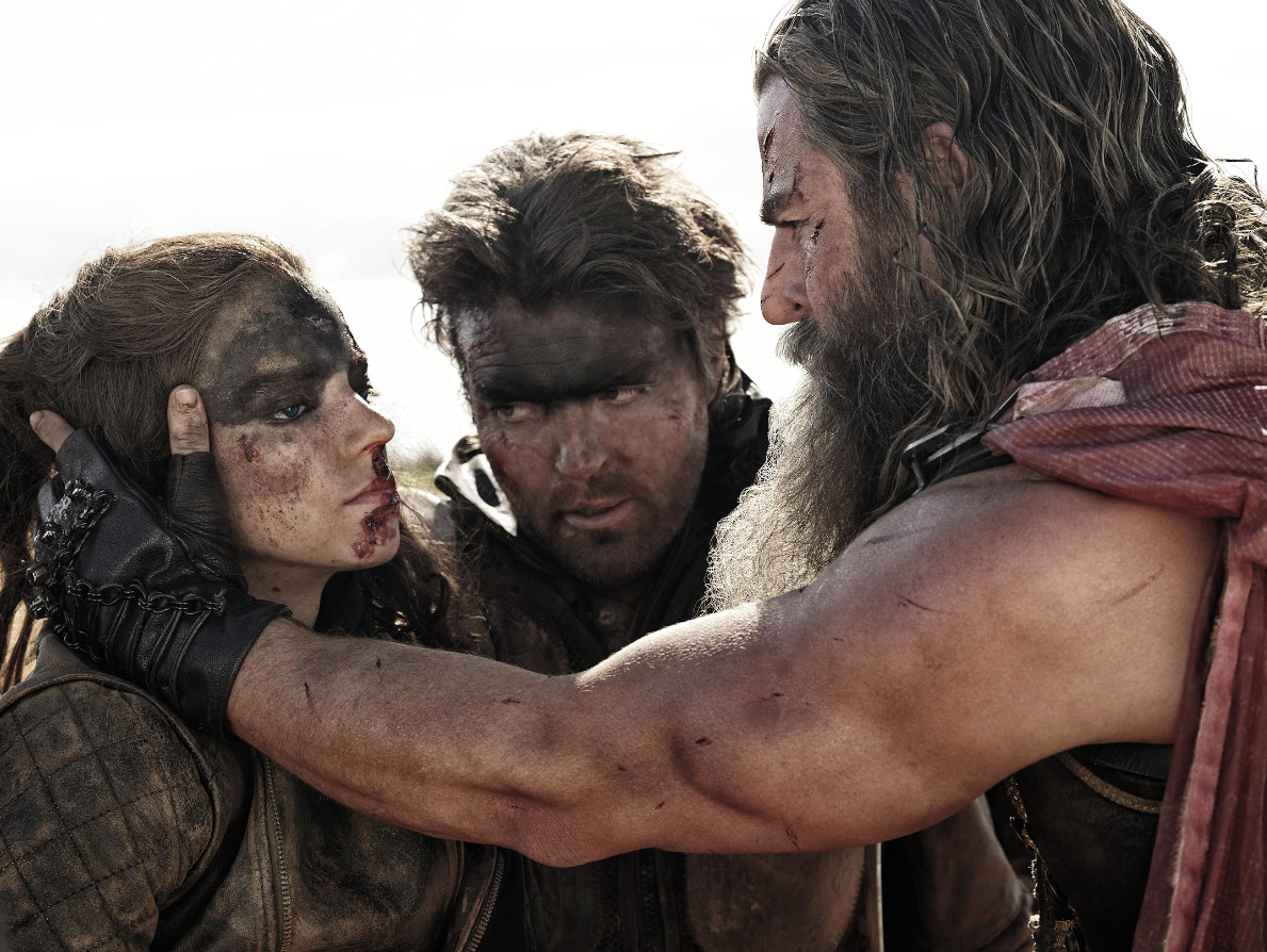 Furiosa (Anya Taylor-Joy), Praetorian Jack (Tom Burke) and Dementus (Chris Hemsworth) in "Furiosa: A Mad Max Saga."