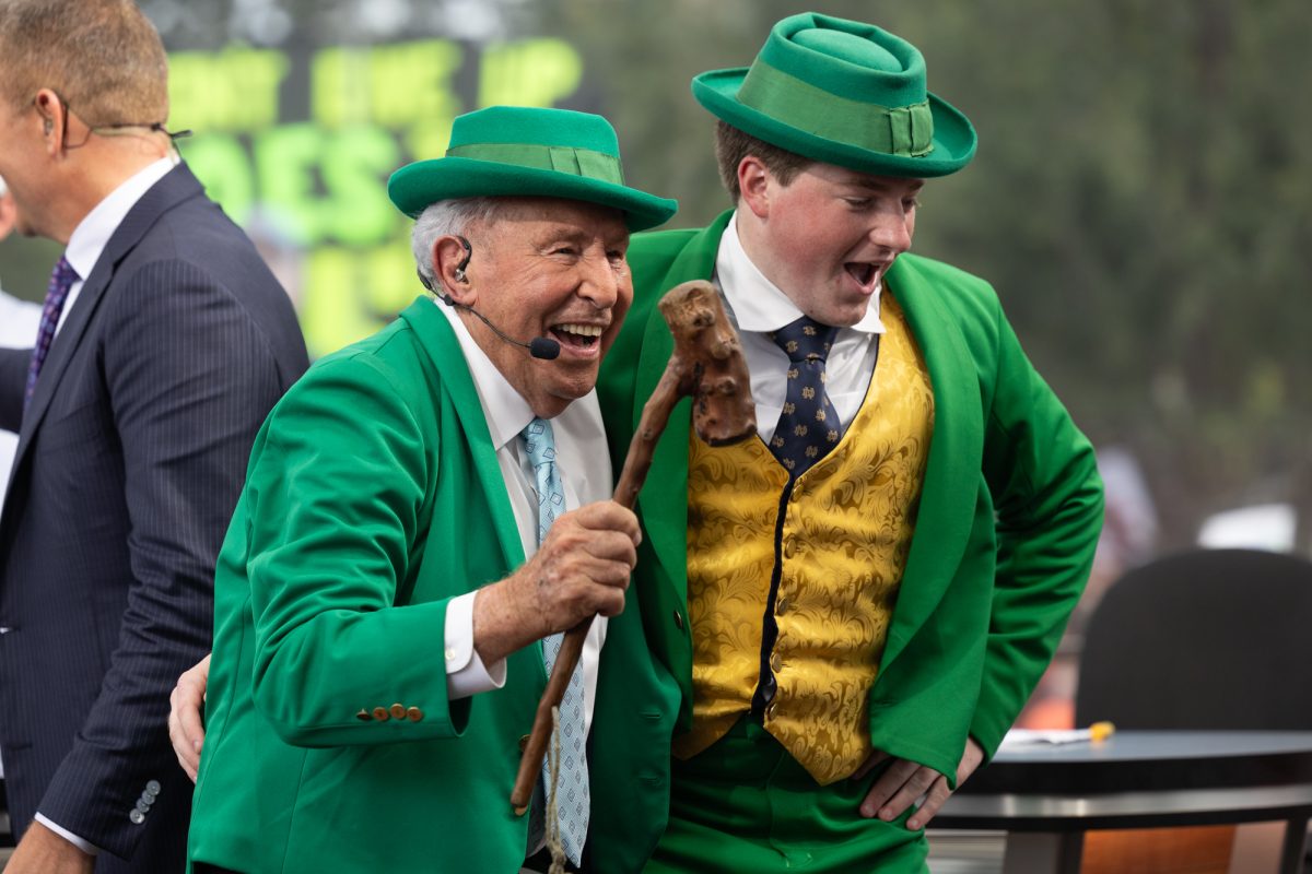 ESPN analyst Lee Corso dances beside the Notre Dame leprechaun mascot after making his pick during College GameDay at Aggie Park on Saturday, Aug. 31, 2024. (Chris Swann/The Battalion)