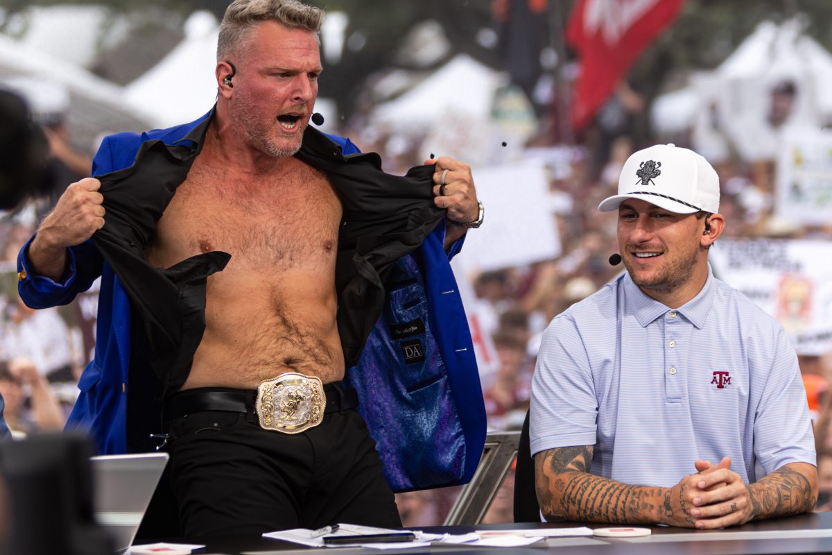 Pat McAfee rips off his shirt after picking Texas A&M to win in their game against Notre Dame during College GameDay in Aggie Park on Saturday, August 31, 2024. (Hannah Harrison/The Battalion)