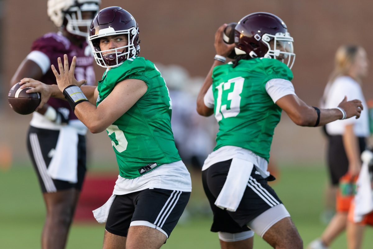 Texas A&amp;M quarterbacks Conner Weigman (15) and Jaylen Henderson (13) throw the ball during the second day of fall football practice outside the Coolidge Football Performance Center on August 1, 2024. (Chris Swann/The Battalion)