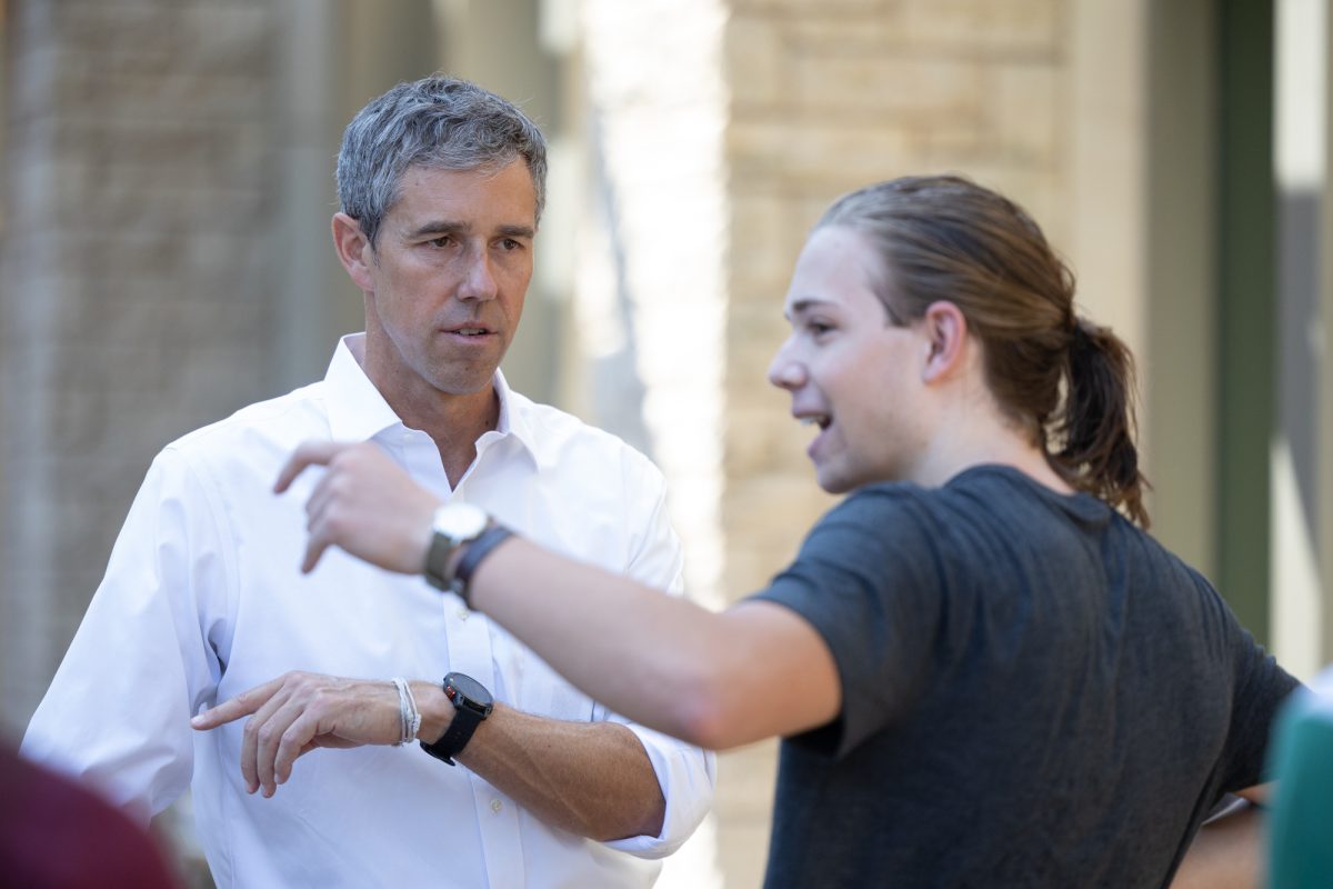 Former congressman Beto O’ Rourke talks to a student outside the Memorial Student Center on Wednesday, Aug. 21, 2024. (Chris Swann/The Battalion)