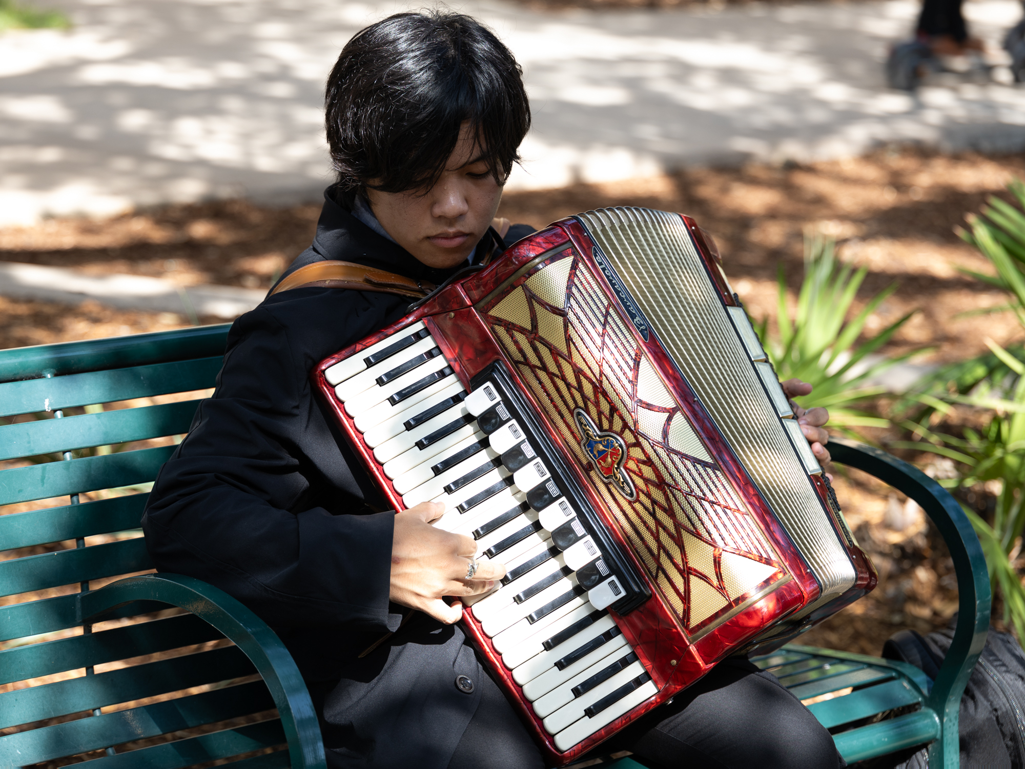 General Studies sophomore Joshua Pattugalan plays his accordian at the Academic Plaza on Wednesday, Aug. 21, 2024. (Sophie Villarreal/The Battalion)