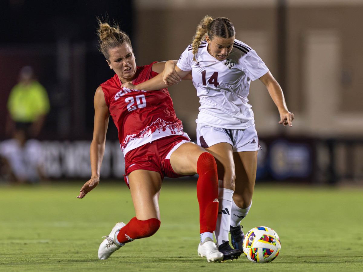 Denver forward Sydney Sharp (14) slides into Texas A&amp;M forward Kennedy Clark (14) during Texas A&amp;M’s game against Denver at Ellis Field on Wednesday, August 21, 2024. (Hannah Harrison/The Battalion)