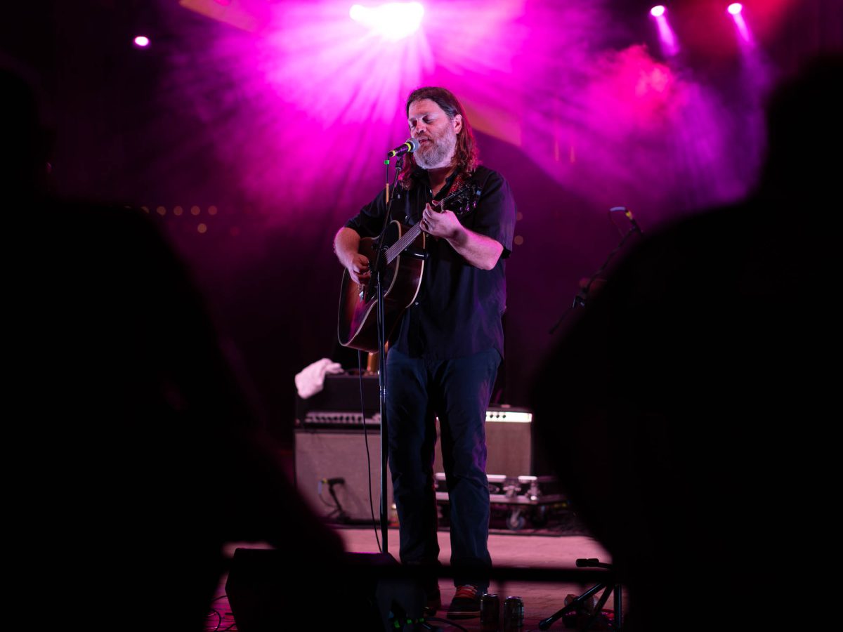 Lead singer Kevin Galloway sings while playing at Farmers Fest in Aggie Park on Thursday, August 22, 2024. (Hannah Harrison/The Battalion)