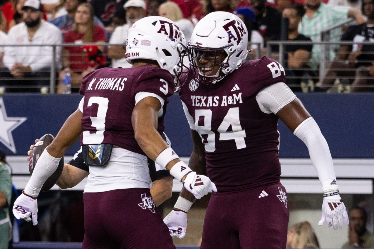 Texas A&amp;M Aggies tight end Tre Watson (84) and Texas A&amp;M Aggies wide receiver Noah Thomas (3) react after Watson’s touchdown during Texas A&amp;M’s game against Arkansas at the Southwest Classic at AT&amp;T Stadium in Arlington, Texas on Saturday, Sept. 28, 2024. (Chris Swann/The Battalion)