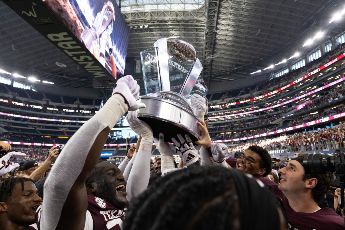 The Aggies raise the Southwest Classic trophy after Texas A&amp;M’s win against Arkansas at the Southwest Classic at AT&amp;T Stadium in Arlington, Texas on Saturday, Sept. 28, 2024. (Chris Swann/The Battalion)