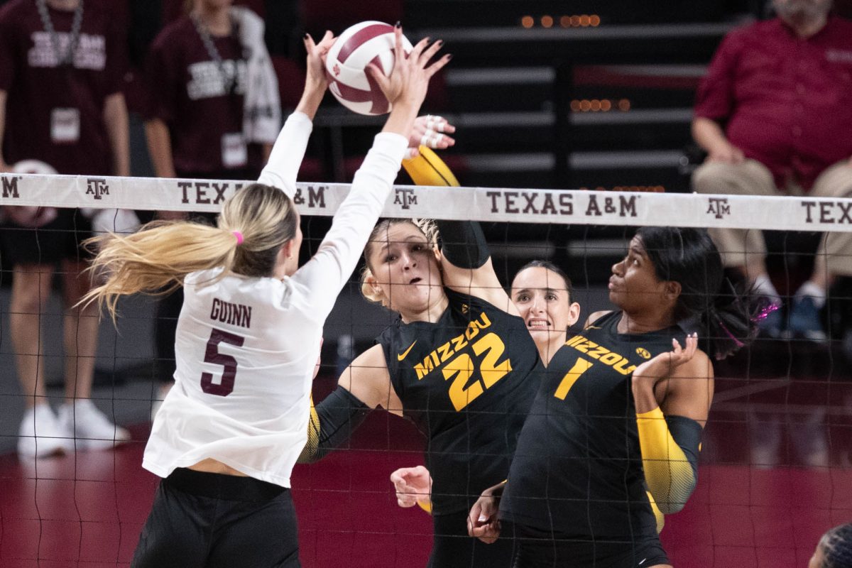 Texas A&amp;M outside hitter Lexi Guinn (5) blocks the ball during Texas A&amp;M’s game against Mizzou at Reed Arena on Sunday, Sept. 29, 2024. (Trinity Hindman/The Battalion)