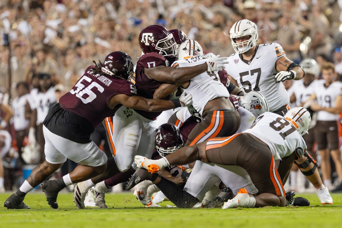 Texas A&M Aggies defensive lineman Albert Regis (17) tackles Bowling Green Falcons running back Terion Stewart (4) during Texas A&M’s game against Bowling Green at Kyle Field on Saturday, Sept. 21, 2024. (Hannah Harrison/The Battalion)