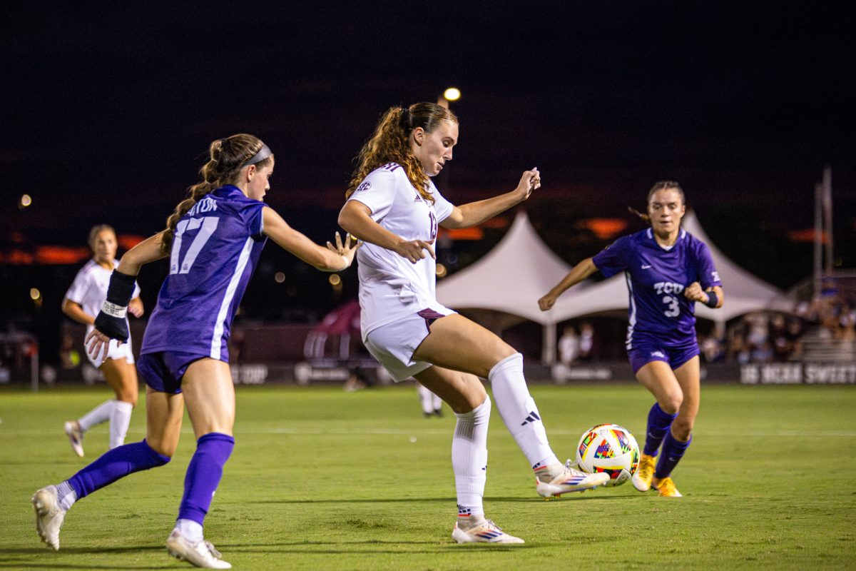 Texas A&amp;M midfielder Mia Pante (13) controls the ball as TCU forward Cameron Patton (17) and forward AJ Hennessey (3) rush in during Texas A&amp;M’s game against TCU at Ellis Field on Thursday, Sept. 5, 2024. (Connor May/The Battalion)