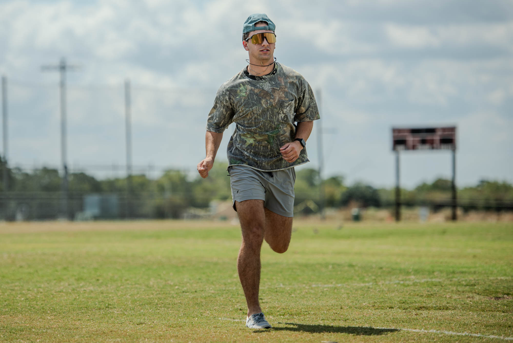 Blinn Business freshman Joshua Eisenberg runs on the grass for exercise on field 8 of the Penberthy Rec Sports Complex on Monday, Sept. 17, 2024 (Addison McDowell/The Battalion)