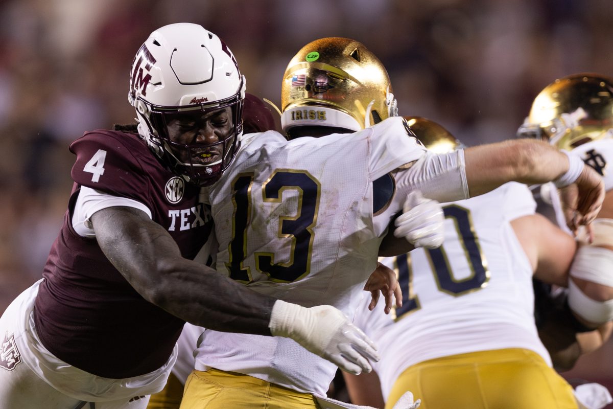 Texas A&M defensive lineman Shemar Stewart (4) hits Notre Dame quarterback Riley Leonard (13) during Texas A&M’s game against Notre Dame at Kyle Field on Saturday, Aug. 31, 2024. (Kyle Heise/The Battalion)