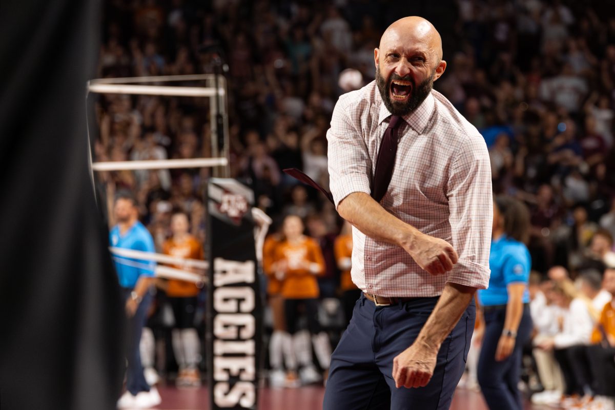 Texas A&M head coach Jamie Morrison celebrates winning a set during Texas A&M’s game against Texas at Reed Arena on Friday, Sept. 27, 2024. (Hannah Harrison/The Battalion)