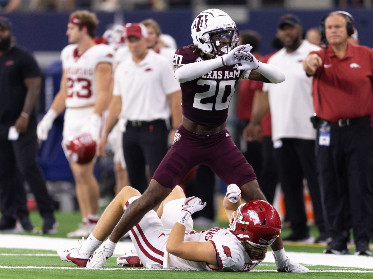 Texas A&M Aggies defensive back BJ Mayes (20) signals for an incompletion over Arkansas Razorbacks wide receiver Isaac TeSlaa (4) during Texas A&M’s game against Arkansas at the Southwest Classic at AT&T Stadium in Arlington, Texas on Saturday, Sept. 28, 2024. (Chris Swann/The Battalion)