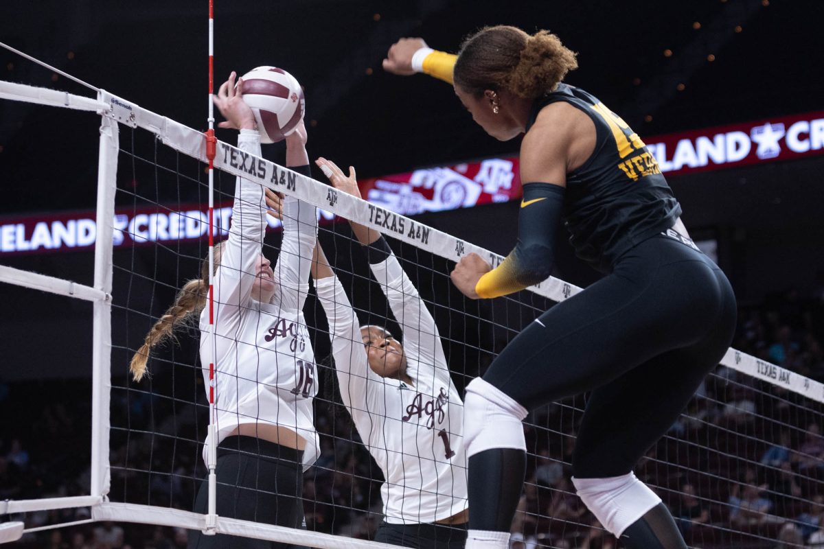 Texas A&amp;M setter Maddie Waak (16) and middle blocker Ifenna Cos-Okpalla (1) block the ball during Texas A&amp;M’s game against Mizzou at Reed Arena on Sunday, Sept. 29, 2024. (Trinity Hindman/The Battalion)