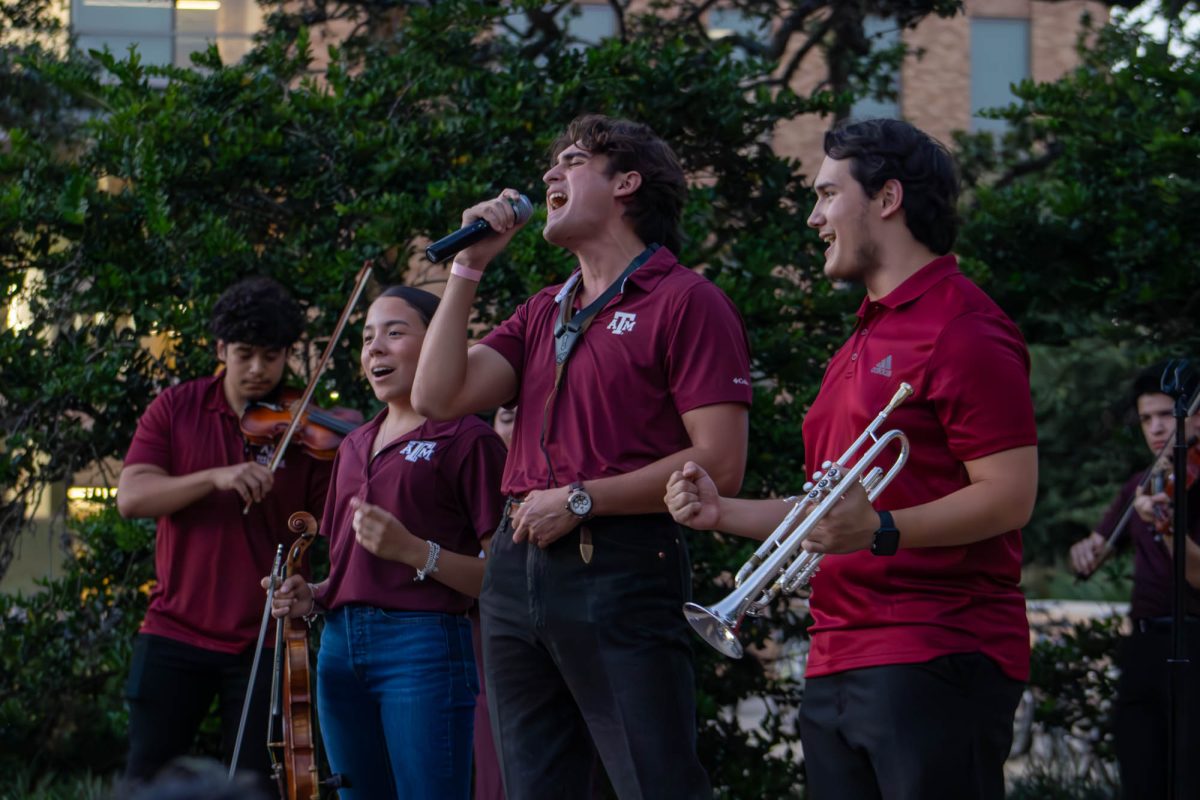 (Left to right) Freshman Mia Garza, Junior Emigdio Chapa, and Freshman Joaquin Razo performs for the Aggieland Mariachi at the HPC Hispanic Heritage Month Kick Off in Rudder Plaza on Monday, Sept. 16, 2024. (Ashely Bautista/The Battalion)