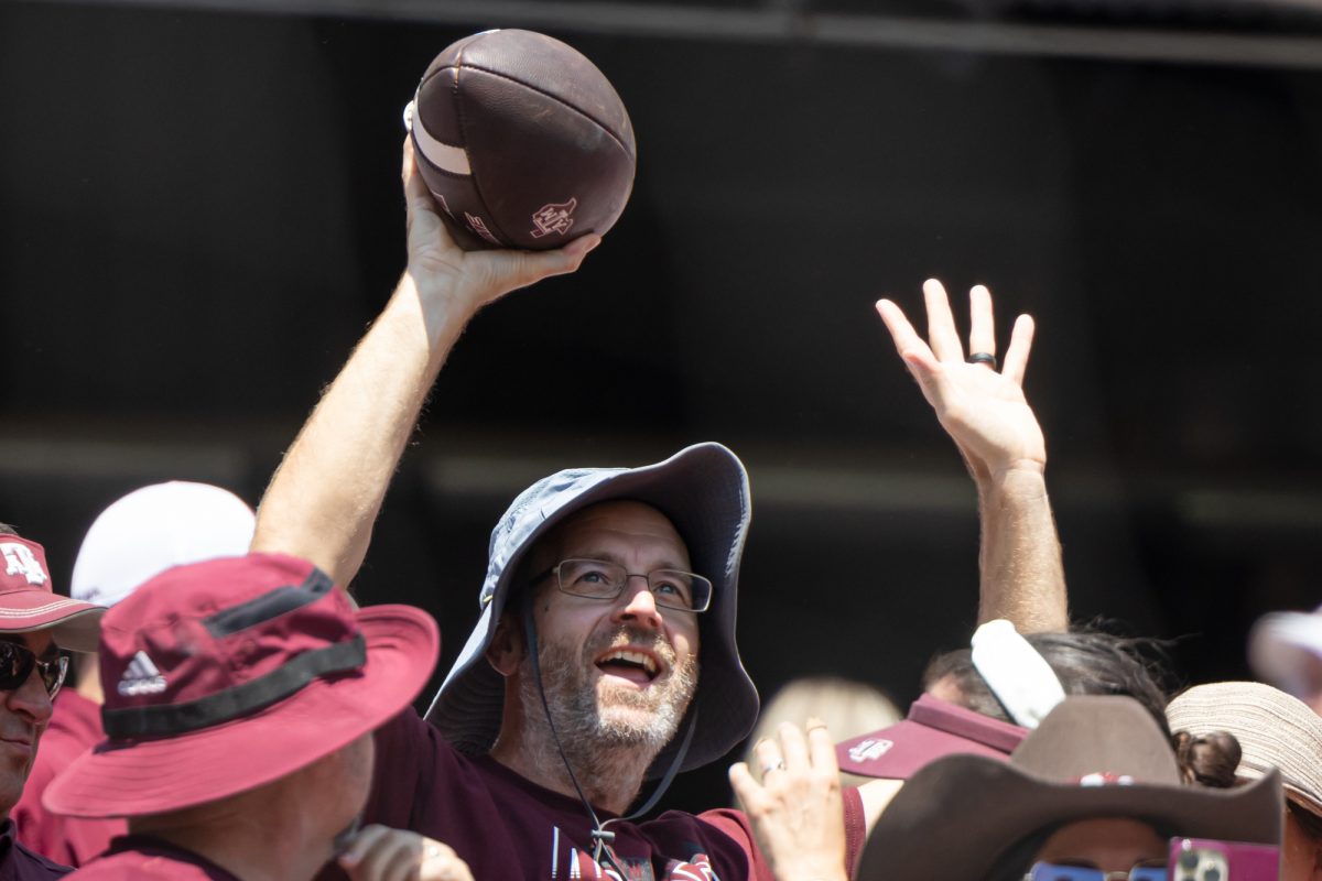 A fan reacts after catching a football that was kicked over the net for a field goal during Texas A&M’s game against McNeese State at Kyle Field on Saturday, Sept. 7, 2024. (Chris Swann/The Battalion)