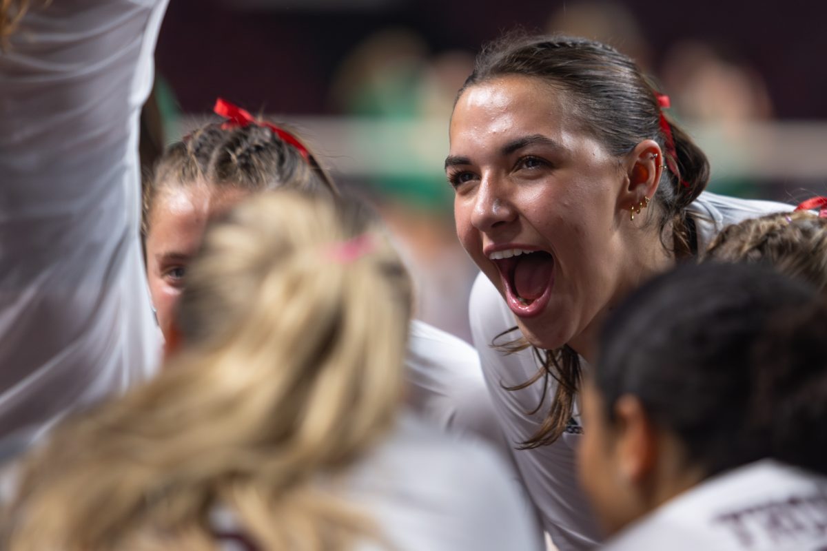 Texas A&amp;M opposite Logan Lednicky (9) cheers in a huddle during Texas A&amp;M’s game against Texas A&amp;M Corpus Christi at Reed Arena on Monday, September 2, 2024. (Hannah Harrison/The Battalion)