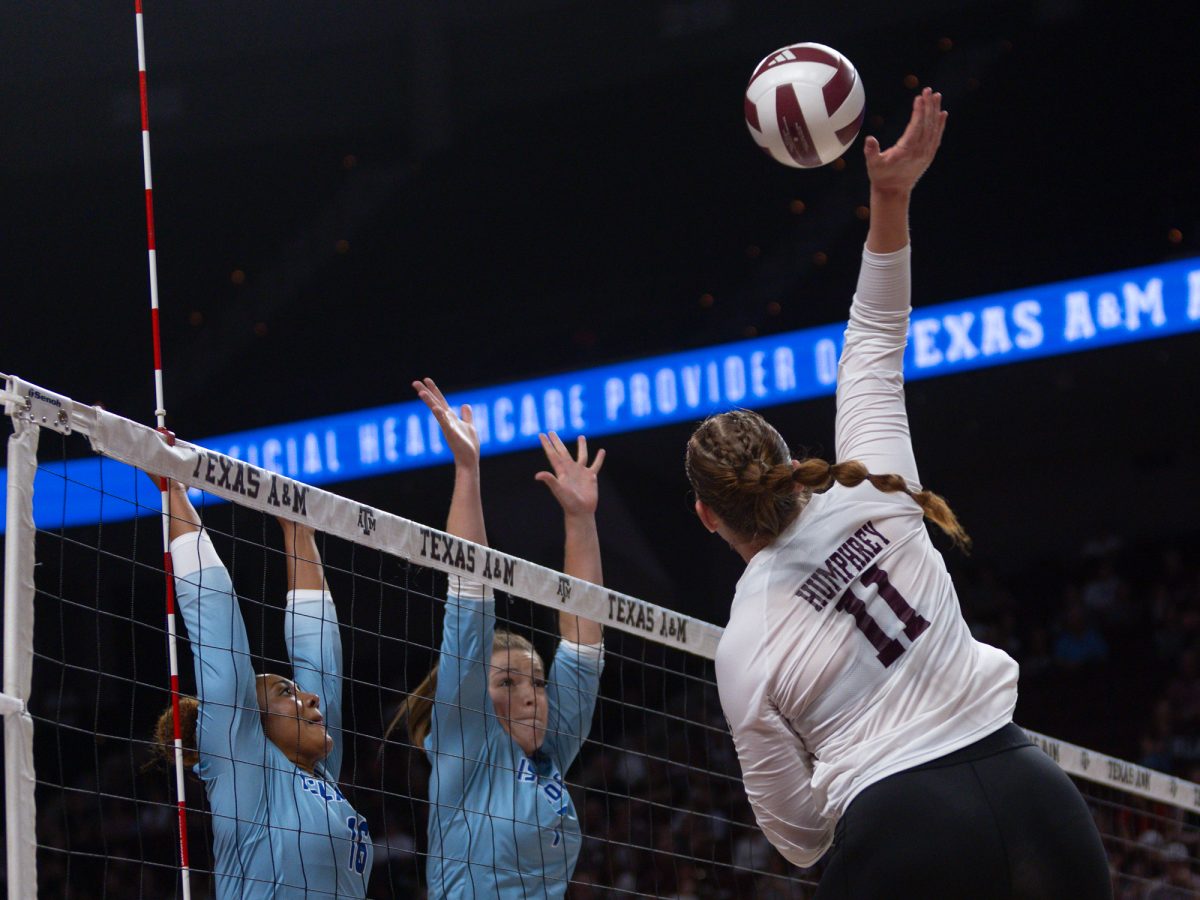 Texas A&amp;M outside hitter Taylor Humphrey (11) hits a ball during Texas A&amp;M’s game against Texas A&amp;M Corpus Christi at Reed Arena on Monday, September 2, 2024. (Hannah Harrison/The Battalion)