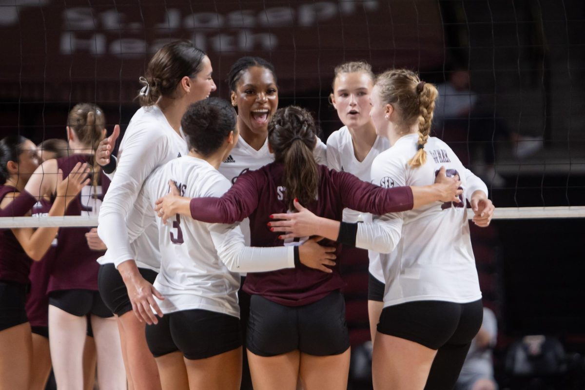 The Texas A&M volleyball team celebrates during Texas A&M's game against Texas State at Reed Arena on Friday, Sept. 6, 2024. (Jaime Rowe/The Battalion)