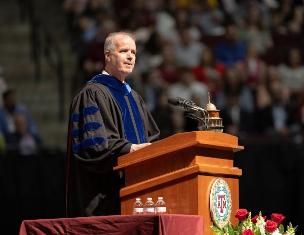 Executive Vice President and Provost Alan Sams speaks to graduating students in Reed Arena in May 2024. 