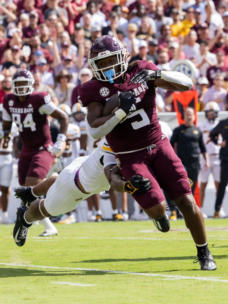 Texas A&amp;M Aggies running back Amari Daniels (5) brakes a tackle at Texas A&amp;M’s game against Missouri at Kyle Field Saturday, Oct. 5, 2024. (Micah Richter/The Battalion)