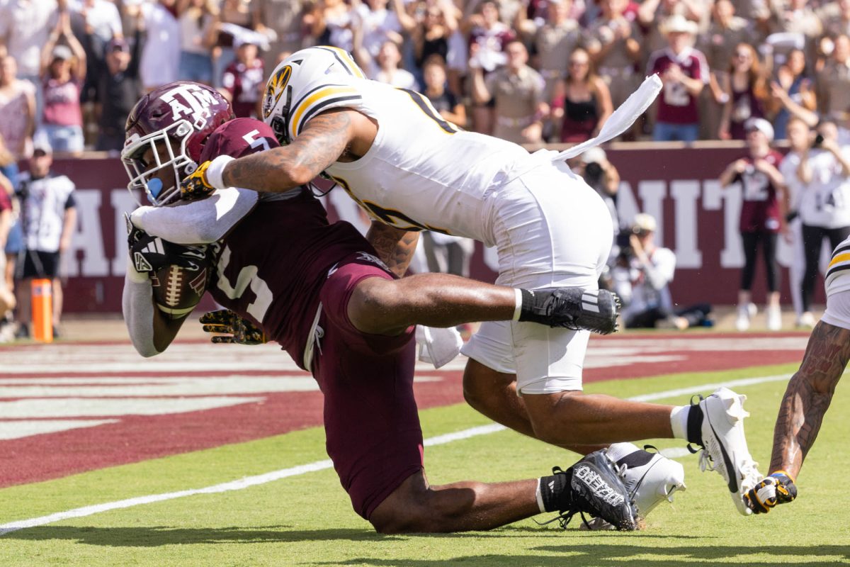 Texas A&amp;M Aggies running back Amari Daniels (5) is tackled at Texas A&amp;M’s game against Missouri at Kyle Field Saturday, Oct. 5, 2024. (Micah Richter/The Battalion)