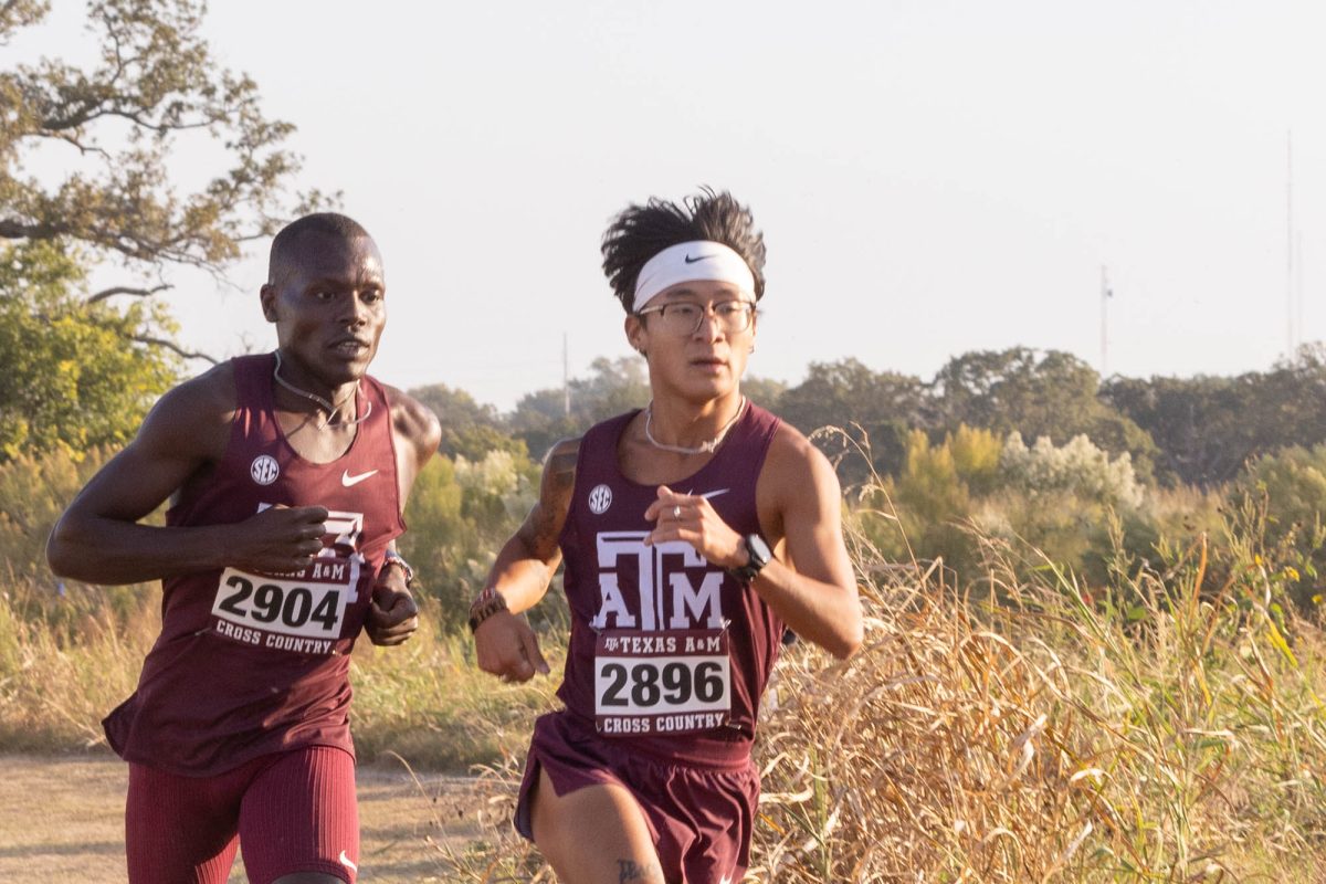 Senior Jonathan Chung and Junoir Victor Kibiego run during Texas A&amp;M's Arturo Barrios Invitational at Dale Watts '71 Cross Country Courseon Friday, Oct. 18, 2024. (Micah Richter/The Battalion)