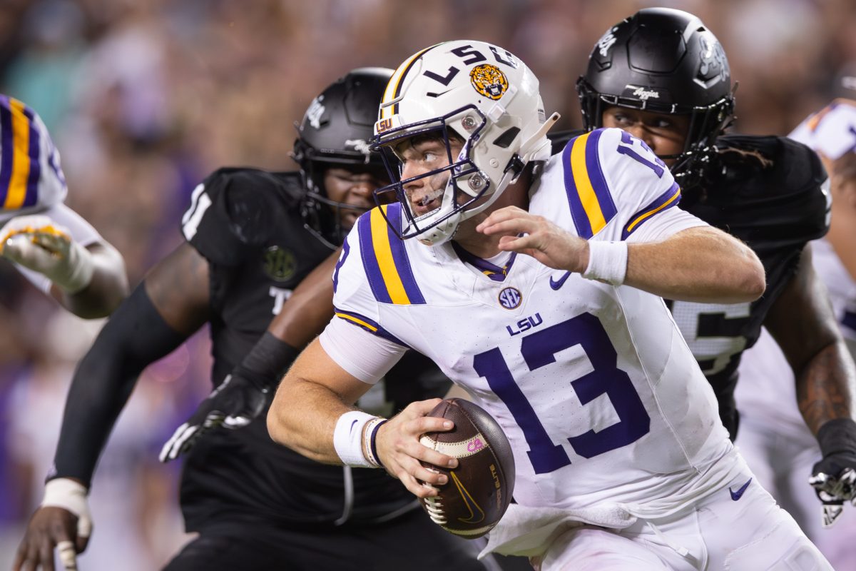 LSU Tigers quarterback Garrett Nussmeier (13) scrambles to throw a ball during Texas A&amp;M’s game against LSU at Kyle Field on Saturday, Oct. 26, 2024. (Hannah Harrison/The Battalion)