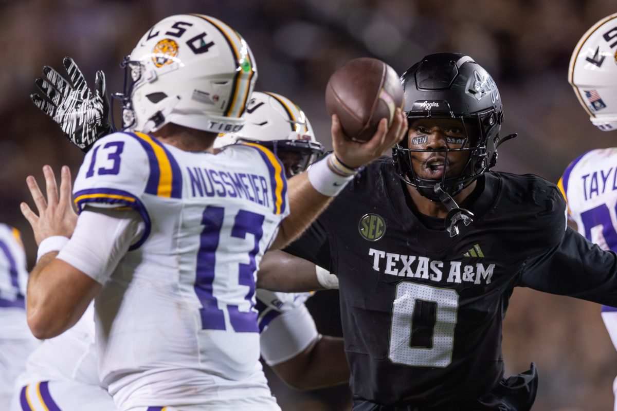 Texas A&amp;M Aggies linebacker Scooby Williams (0) looks at LSU Tigers quarterback Garrett Nussmeier (13) during Texas A&amp;M’s game against LSU at Kyle Field on Saturday, Oct. 26, 2024. (Hannah Harrison/The Battalion)