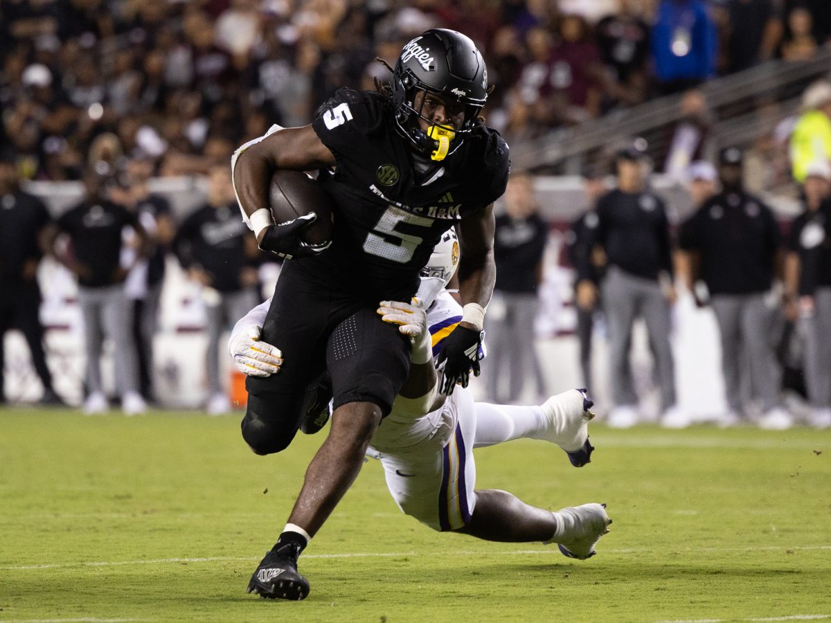 Texas A&amp;M Aggies running back Amari Daniels (5) breaks a tackle during Texas A&amp;M’s game against LSU at Kyle Field on Friday, Oct. 25, 2024. (Chris Swann/The Battalion)