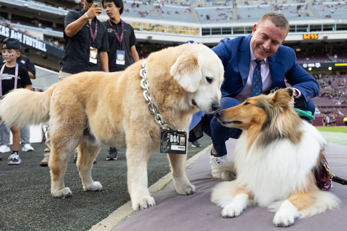 Kirk Herbstreit and his dog Ben meet Miss Rev before Texas A&amp;M’s game against LSU at Kyle Field on Saturday, Oct. 26, 2024. (Hannah Harrison/The Battalion)