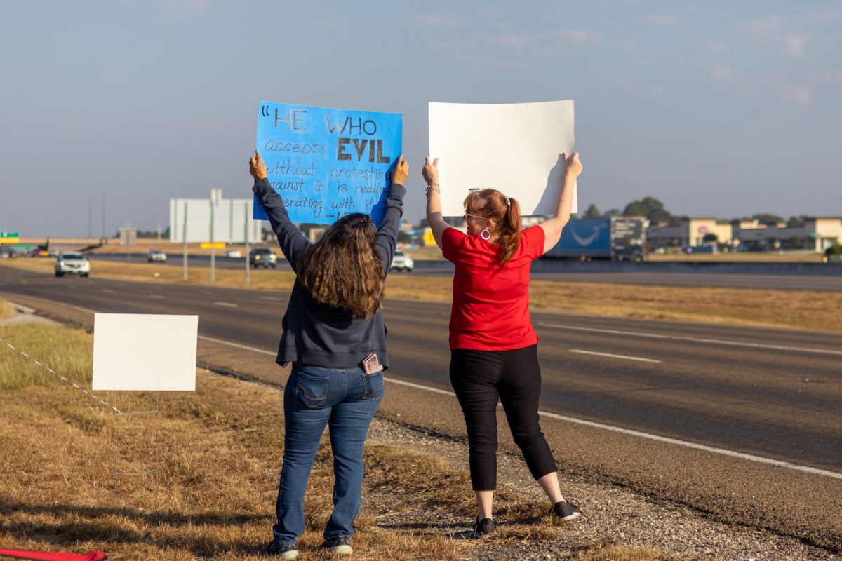 Protester Vera Hernandez demonstrates on the roadside against alleged abuses by the Christland Church on Saturday, Oct. 12, 2024.