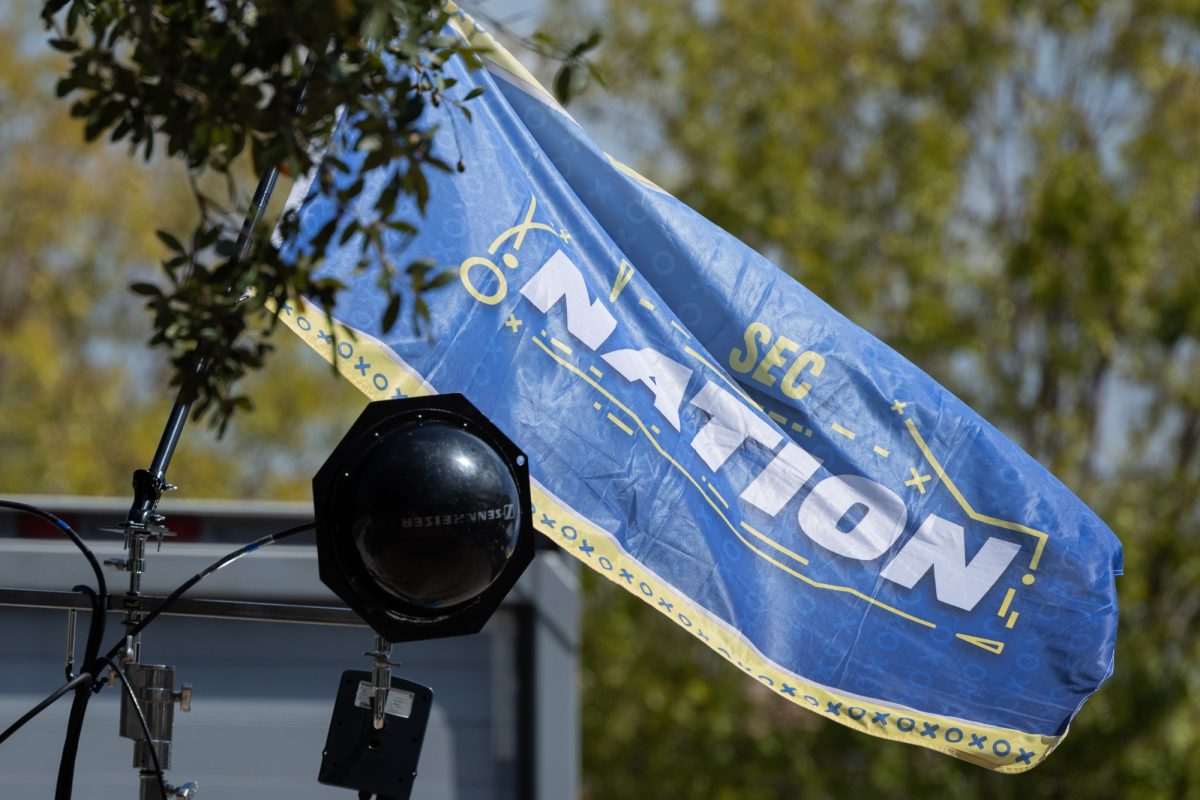 An SEC Network flag flies on the set of SEC Nation during the taping of The Paul Finebaum Show at Aggie Park on Friday, Oct. 4, 2024. (Chris Swann/The Battalion)