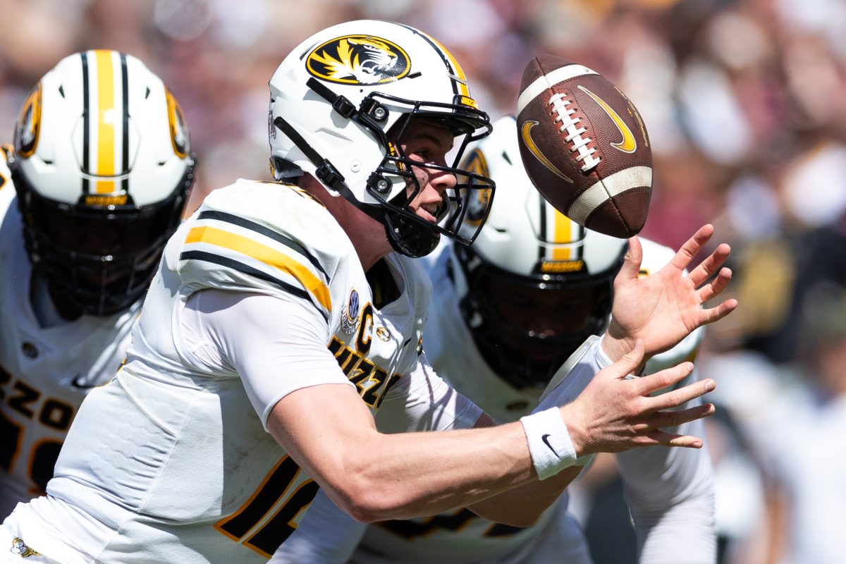 Missouri Tigers quarterback Brady Cook (12) bobbles the ball as he rolls out of the pocket during Texas A&amp;M’s game against Missouri at Kyle Field Saturday, Oct. 5, 2024. (Chris Swann/The Battalion)