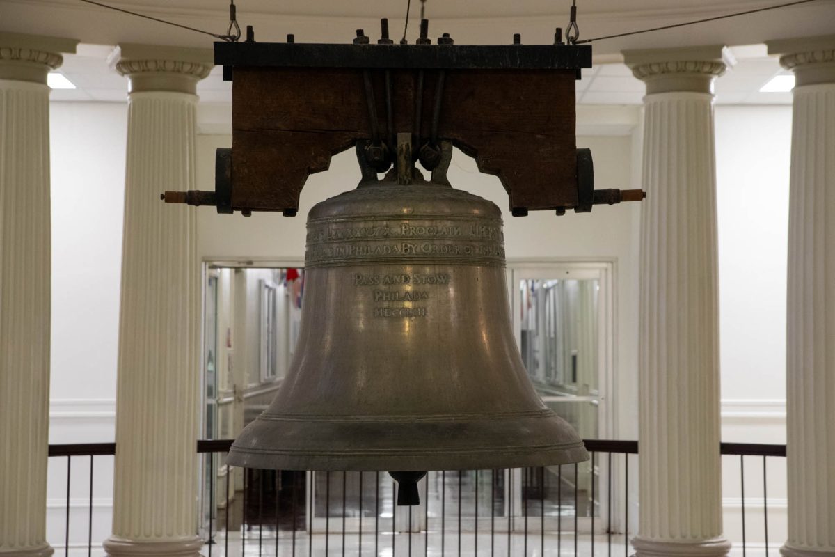 The liberty bell replica suspended inside the Academic Building on Friday, Oct. 18, 2024. (Isabel Lubrano/The Battalion).