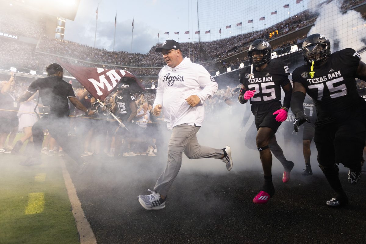 Texas A&M Head Coach Mike Elko leads the Aggies onto the field before Texas A&M's game against LSU at Kyle Field on Saturday, Oct. 26, 2024. (Adriano Espinosa/The Battalion)